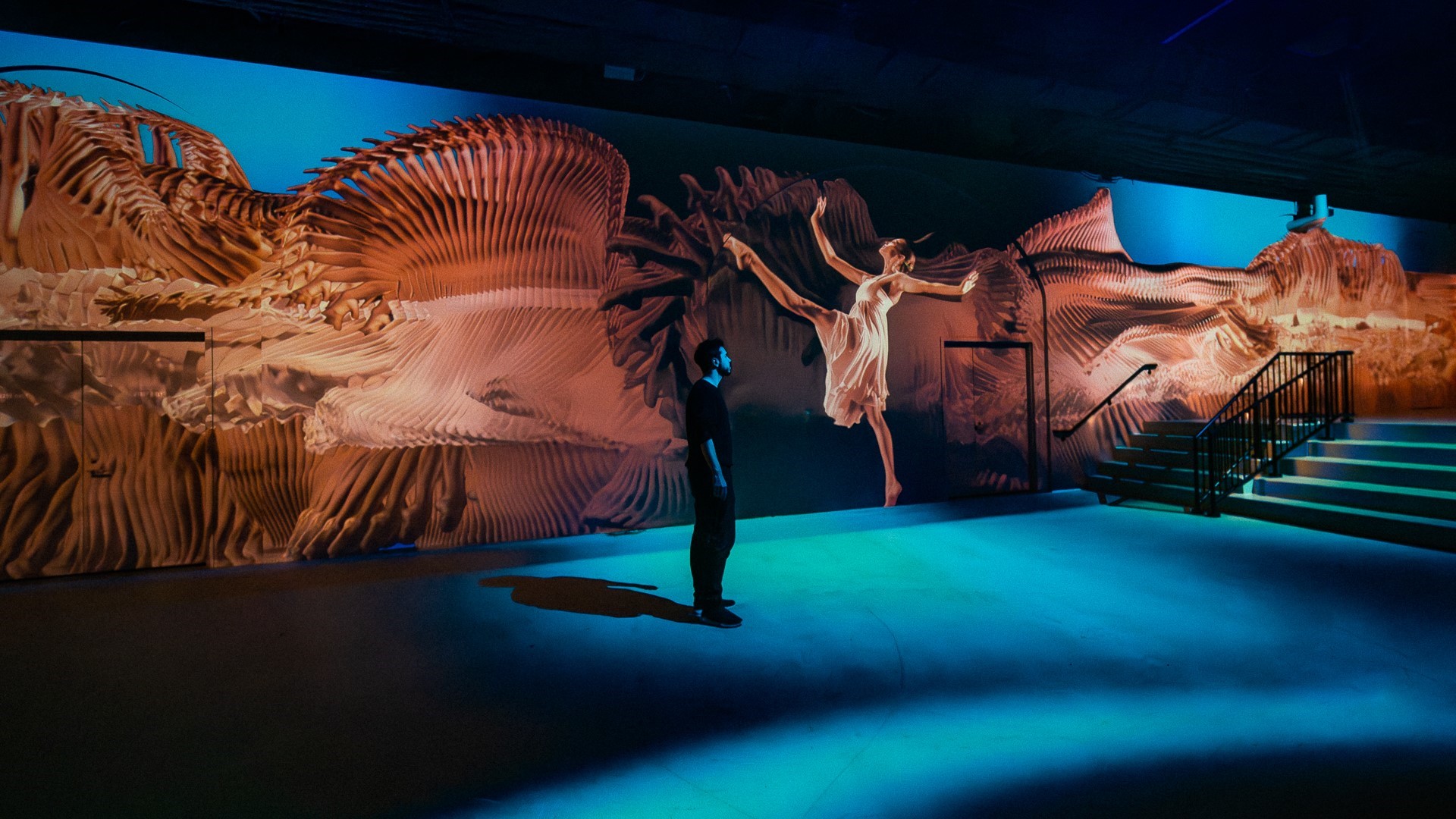From immersive installation 5 Movements, with a man in black shirt standing